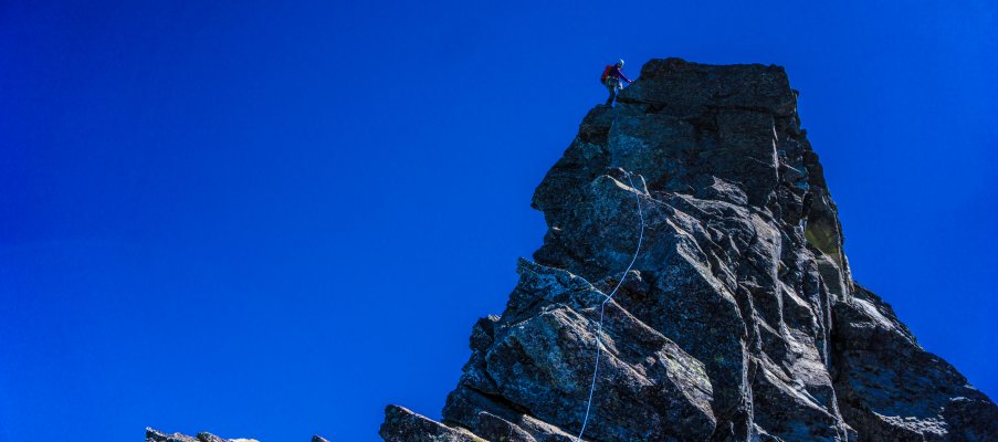 Topping out on a steep section of the West Ridge.